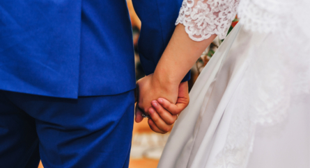 Bride And Groom Holding Hands