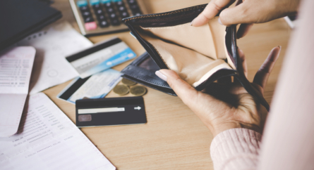 Female Hand Opening Empty Wallet