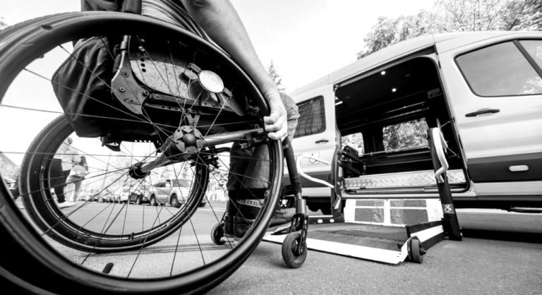 Individual in a wheelchair getting ready to get into a van