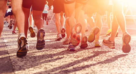 Shot of marathon runners running from the waist down.